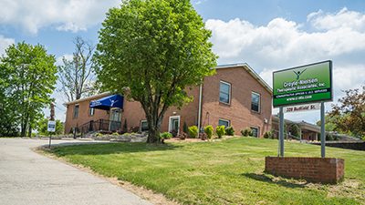 C-NTA® Johnstown Administrative and IDD Office Building, brick building with green sign in front